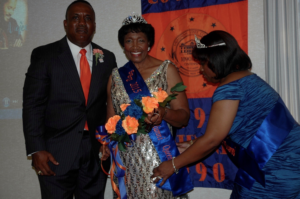 SAVANNAH, Ga. — SSUNAA National President Clyde Newton (l) and 2014 SSUNAA National Queen Pamela Yancy-Holmes (r) present the official sash to the 2015 National Queen, . photo by Absolon Kent
